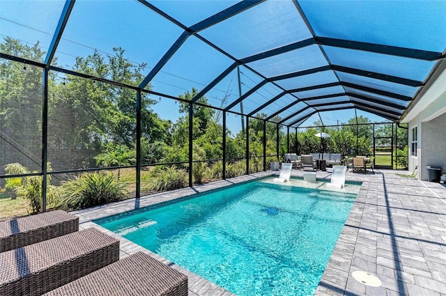 outdoor pool with an outdoor living space, a patio, and a lanai