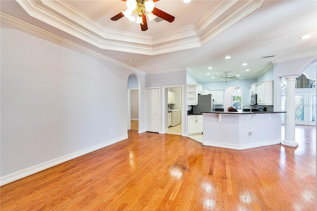 8315 Raoul Ave, North Port, FL 34291 - kitchen with a ceiling fan, arched walkways, appliances with stainless steel finishes, ornate columns, and ornamental molding