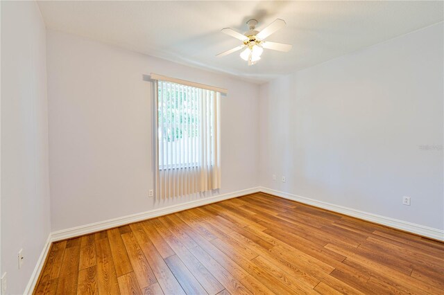 8315 Raoul Ave, North Port, FL 34291 - empty room featuring light wood-type flooring, ceiling fan, and baseboards