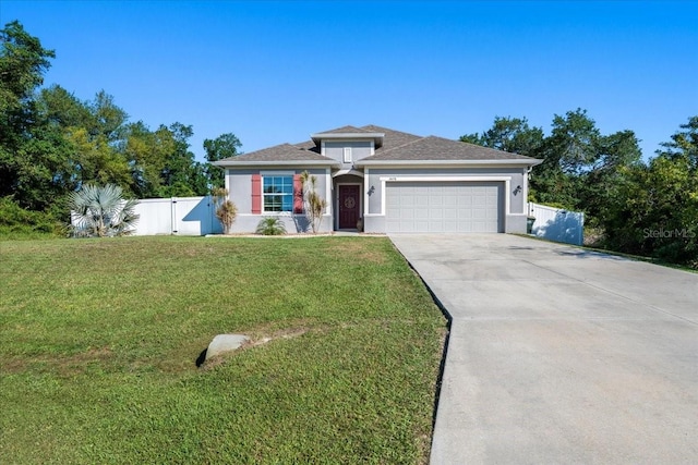 3476 Brewster Rd, North Port, FL 34288 - single story home with concrete driveway, a gate, a front yard, a garage, and fence