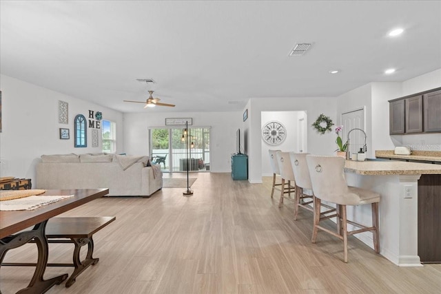 3476 Brewster Rd, North Port, FL 34288 - living area with light wood-style flooring, a ceiling fan, visible vents, and recessed lighting