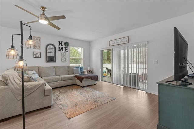 3476 Brewster Rd, North Port, FL 34288 - living room with baseboards, a ceiling fan, and wood finished floors