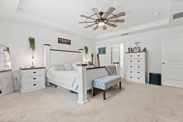 3476 Brewster Rd, North Port, FL 34288 - bedroom with visible vents, a tray ceiling, and light colored carpet