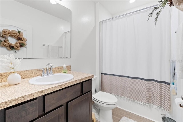 3476 Brewster Rd, North Port, FL 34288 - full bath featuring shower / tub combo, toilet, vanity, and wood finished floors