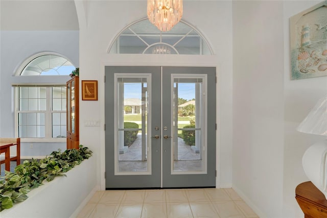229 Sportsman Rd, Rotonda West, FL 33947 - entryway with french doors, an inviting chandelier, and baseboards