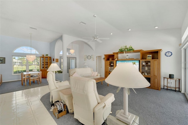 229 Sportsman Rd, Rotonda West, FL 33947 - carpeted living area with recessed lighting, visible vents, high vaulted ceiling, arched walkways, and ceiling fan with notable chandelier
