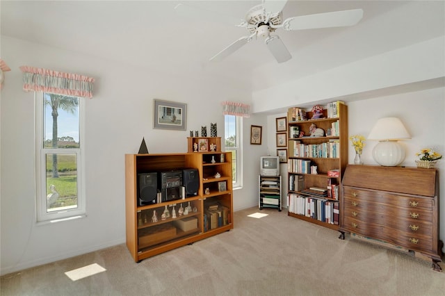 229 Sportsman Rd, Rotonda West, FL 33947 - sitting room featuring ceiling fan, carpet, and a healthy amount of sunlight
