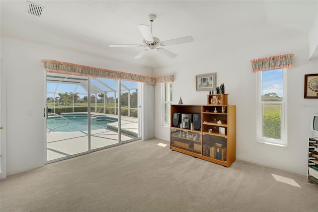 229 Sportsman Rd, Rotonda West, FL 33947 - interior space featuring ceiling fan, a sunroom, and visible vents