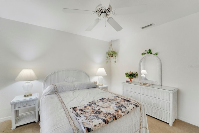 229 Sportsman Rd, Rotonda West, FL 33947 - bedroom with visible vents, baseboards, ceiling fan, and light colored carpet