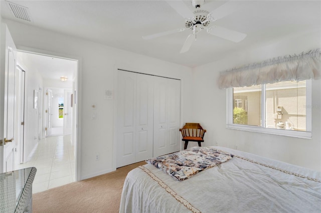 229 Sportsman Rd, Rotonda West, FL 33947 - bedroom featuring visible vents, a closet, baseboards, ceiling fan, and light carpet
