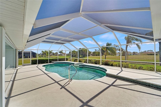 229 Sportsman Rd, Rotonda West, FL 33947 - view of swimming pool with a pool with connected hot tub, a patio, and glass enclosure