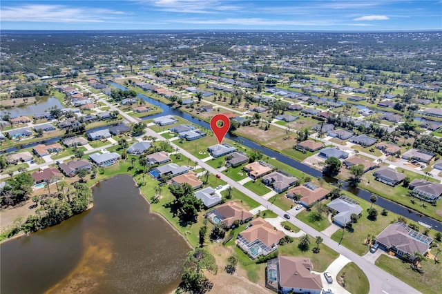 229 Sportsman Rd, Rotonda West, FL 33947 - birds eye view of property featuring a residential view and a water view
