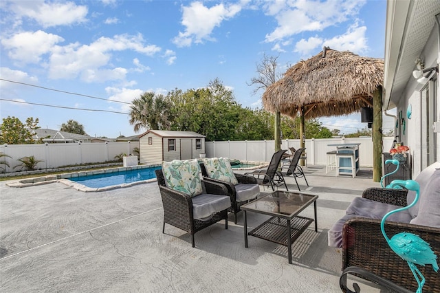 242 Seminole Blvd NW, Port Charlotte, FL 33952 - view of patio with a storage shed, a fenced backyard, a gazebo, and a fenced in pool