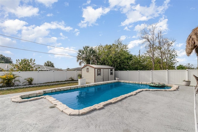 242 Seminole Blvd NW, Port Charlotte, FL 33952 - view of swimming pool featuring a fenced in pool, a patio area, a fenced backyard, and an outdoor structure
