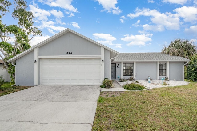 242 Seminole Blvd NW, Port Charlotte, FL 33952 - ranch-style house with a front yard, driveway, stucco siding, and an attached garage