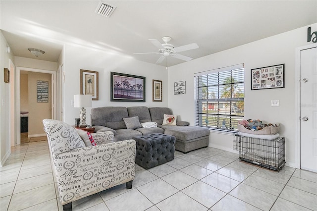 242 Seminole Blvd NW, Port Charlotte, FL 33952 - living area featuring light tile patterned floors, baseboards, a ceiling fan, and visible vents
