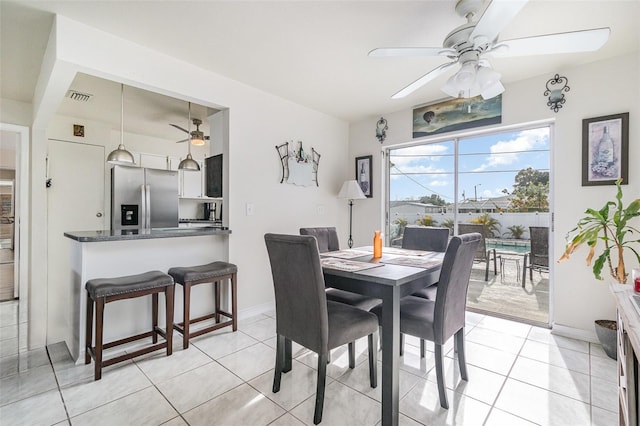 242 Seminole Blvd NW, Port Charlotte, FL 33952 - dining area with light tile patterned floors, visible vents, baseboards, and a ceiling fan