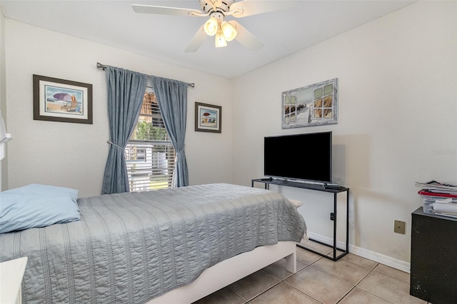 242 Seminole Blvd NW, Port Charlotte, FL 33952 - bedroom with baseboards, a ceiling fan, and light tile patterned flooring