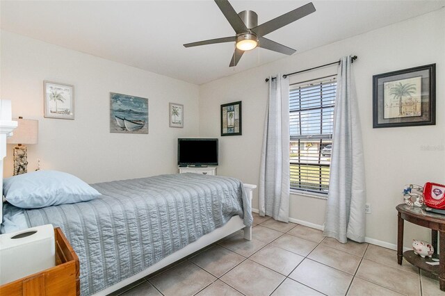 242 Seminole Blvd NW, Port Charlotte, FL 33952 - bedroom featuring light tile patterned floors, baseboards, and a ceiling fan