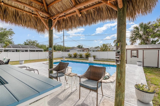 242 Seminole Blvd NW, Port Charlotte, FL 33952 - view of pool featuring a patio area, a fenced backyard, an outdoor structure, and a fenced in pool