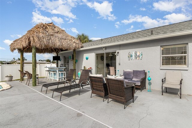 242 Seminole Blvd NW, Port Charlotte, FL 33952 - view of patio with an outdoor living space and fence