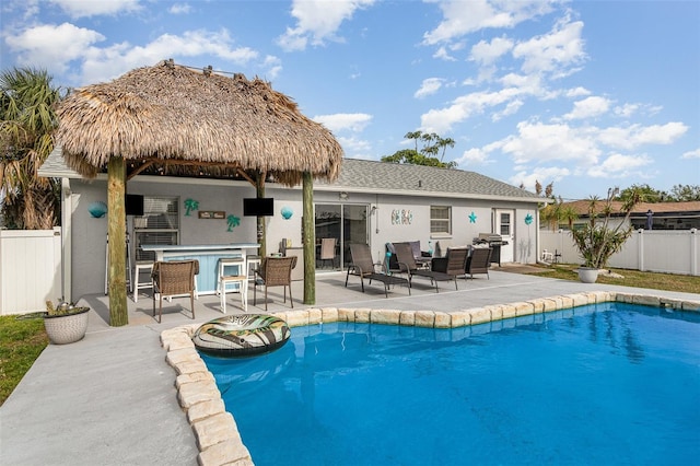 242 Seminole Blvd NW, Port Charlotte, FL 33952 - view of pool with a fenced backyard, a fenced in pool, a patio, and outdoor dry bar