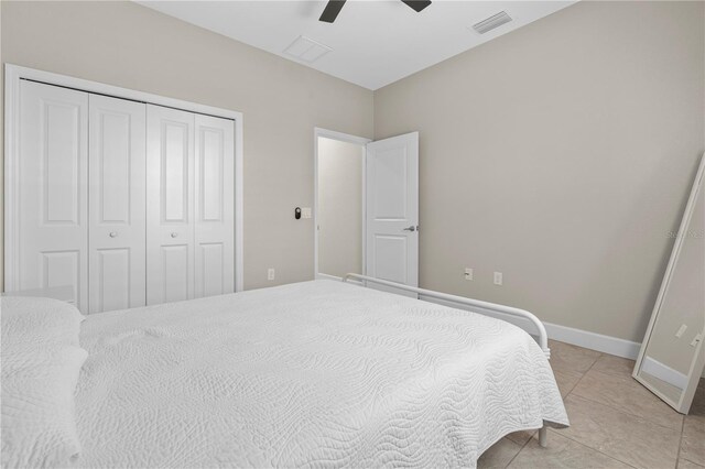 2229 Wakefield St, Port Charlotte, FL 33948 - bedroom with a closet, a ceiling fan, light tile patterned flooring, and baseboards