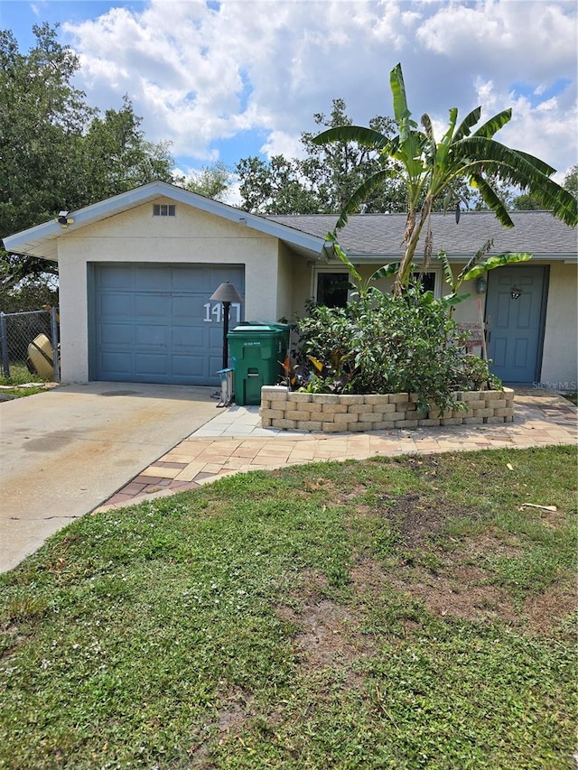 1457 Sheehan Blvd, Port Charlotte, FL 33952 - ranch-style house featuring concrete driveway, stucco siding, and an attached garage