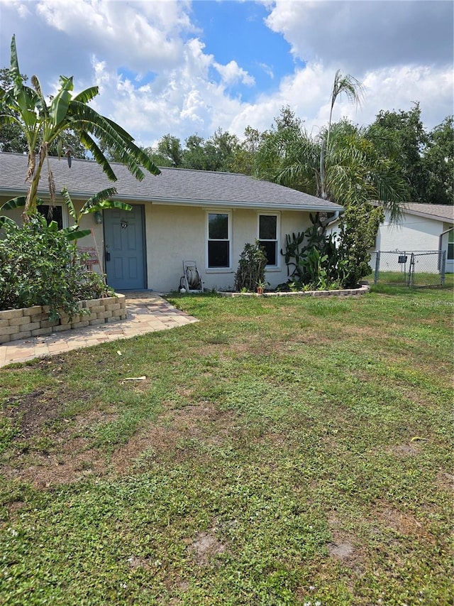1457 Sheehan Blvd, Port Charlotte, FL 33952 - back of property featuring stucco siding