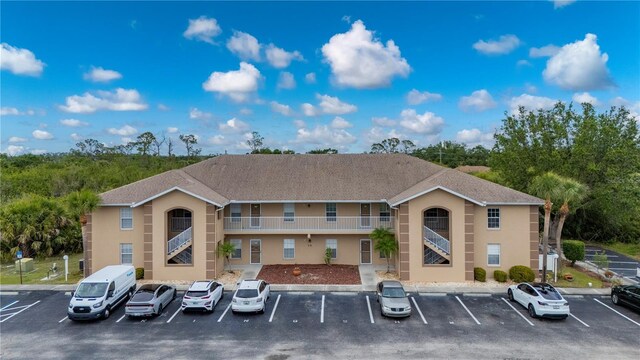 175 Kings Hwy Unit B21522, Punta Gorda, FL 33983 - view of building exterior with uncovered parking