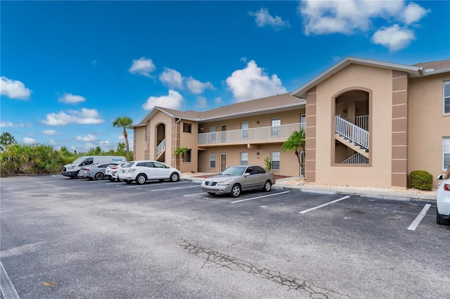 175 Kings Hwy Unit B21522, Punta Gorda, FL 33983 - view of building exterior with uncovered parking