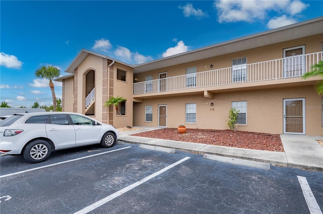 175 Kings Hwy Unit B21522, Punta Gorda, FL 33983 - view of building exterior featuring uncovered parking