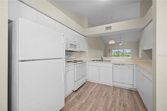 175 Kings Hwy Unit B21522, Punta Gorda, FL 33983 - kitchen featuring visible vents, a sink, light countertops, white appliances, and light wood-style flooring
