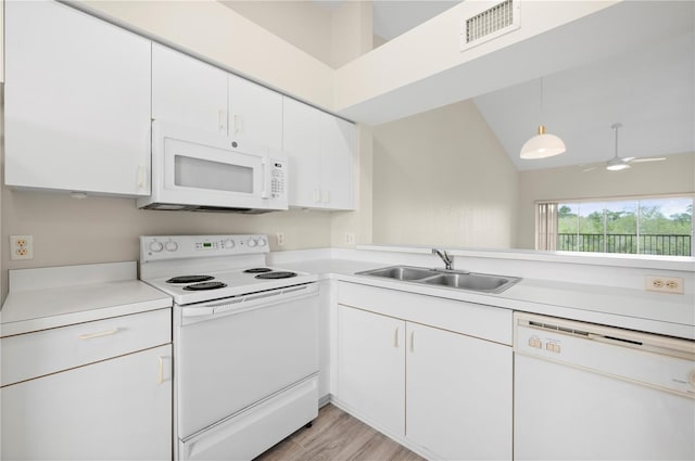 175 Kings Hwy Unit B21522, Punta Gorda, FL 33983 - kitchen featuring white appliances, light countertops, white cabinets, visible vents, and a sink
