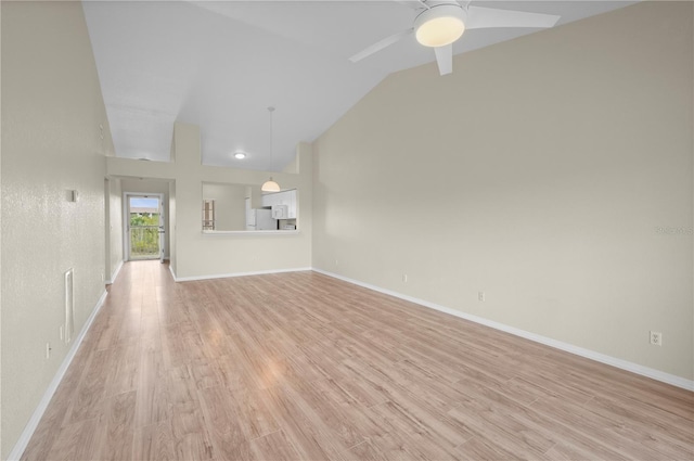 175 Kings Hwy Unit B21522, Punta Gorda, FL 33983 - unfurnished living room featuring light wood-style floors, high vaulted ceiling, ceiling fan, and baseboards