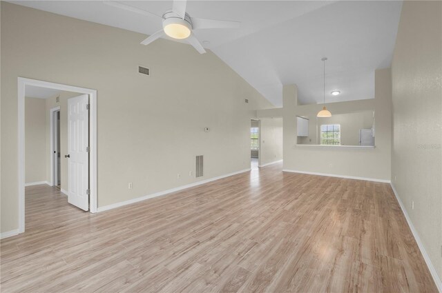 175 Kings Hwy Unit B21522, Punta Gorda, FL 33983 - unfurnished living room with high vaulted ceiling, visible vents, and light wood-style flooring