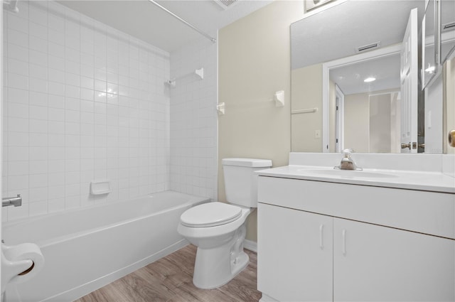 175 Kings Hwy Unit B21522, Punta Gorda, FL 33983 - bathroom featuring visible vents, toilet, bathtub / shower combination, vanity, and wood finished floors