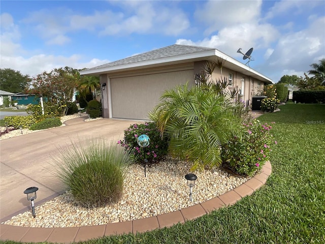 1536 Willow Dl, Sebring, FL 33872 - view of property exterior featuring a shingled roof, a lawn, a garage, stucco siding, and driveway