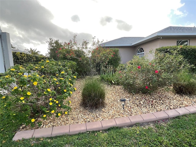 1536 Willow Dl, Sebring, FL 33872 - view of property exterior featuring a shingled roof and stucco siding