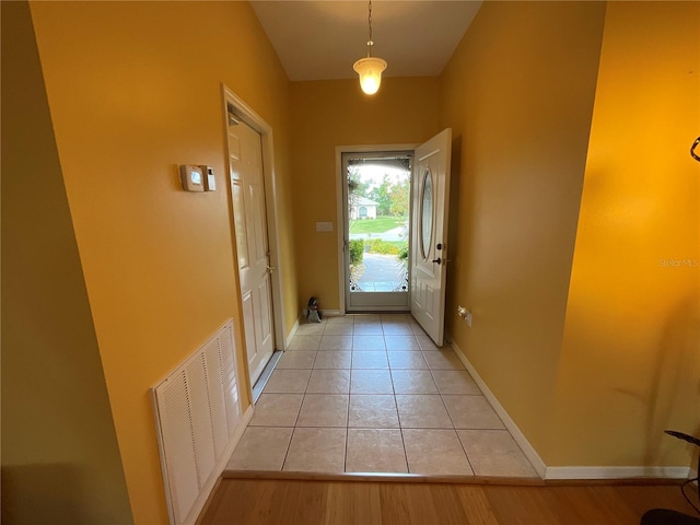 1536 Willow Dl, Sebring, FL 33872 - doorway featuring light tile patterned flooring, baseboards, and visible vents
