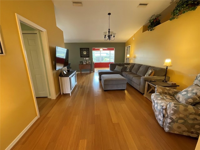 1536 Willow Dl, Sebring, FL 33872 - living area with a chandelier, wood finished floors, baseboards, and visible vents