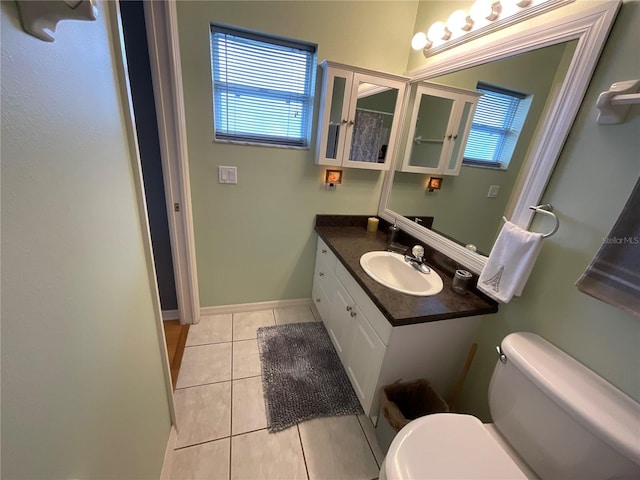 1536 Willow Dl, Sebring, FL 33872 - bathroom featuring a wealth of natural light, tile patterned flooring, vanity, and toilet