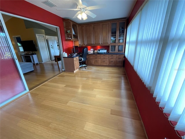 1536 Willow Dl, Sebring, FL 33872 - office featuring light wood finished floors, visible vents, built in desk, and a ceiling fan
