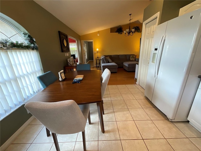 1536 Willow Dl, Sebring, FL 33872 - dining area featuring a chandelier, light tile patterned floors, and lofted ceiling