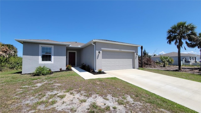 26456 View Dr, Punta Gorda, FL 33983 - ranch-style house featuring an attached garage, stucco siding, and concrete driveway