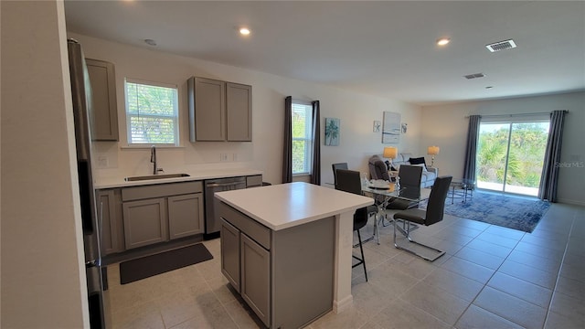 26456 View Dr, Punta Gorda, FL 33983 - kitchen featuring gray cabinets, stainless steel dishwasher, healthy amount of natural light, and recessed lighting