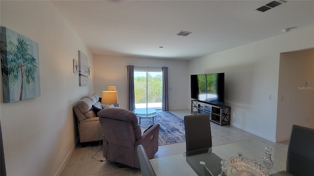 26456 View Dr, Punta Gorda, FL 33983 - living room featuring baseboards and light tile patterned floors