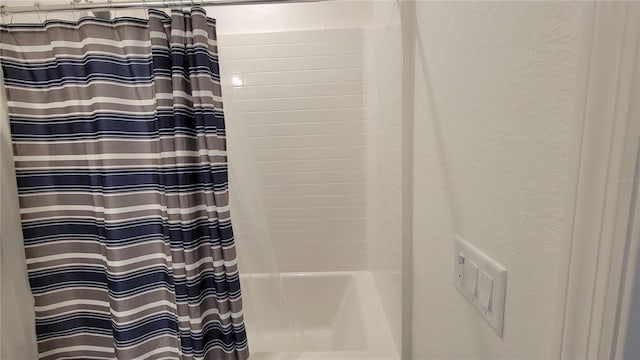 26456 View Dr, Punta Gorda, FL 33983 - bathroom view of a textured wall and shower / tub combo with curtain