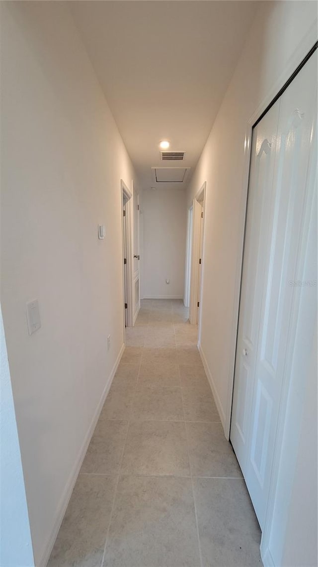 26456 View Dr, Punta Gorda, FL 33983 - corridor featuring light tile patterned flooring and baseboards