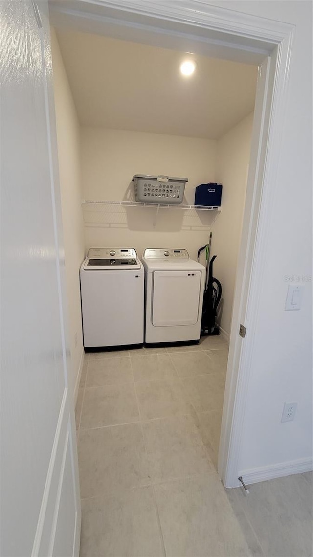 26456 View Dr, Punta Gorda, FL 33983 - washroom with washing machine and dryer and light tile patterned floors